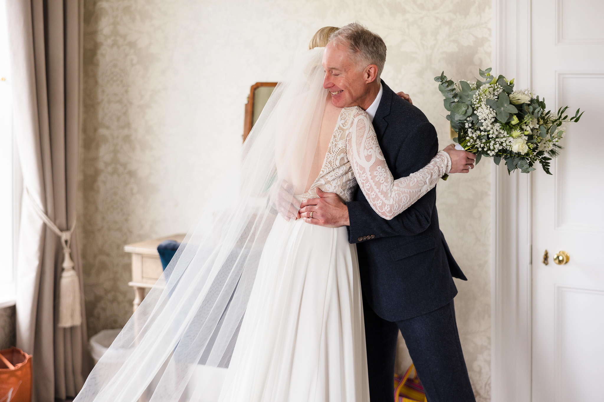 Father hugging bride